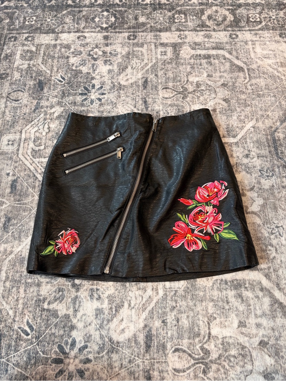 Divided Black Faux Leather Mini Skirt with Pink Floral Appliqué